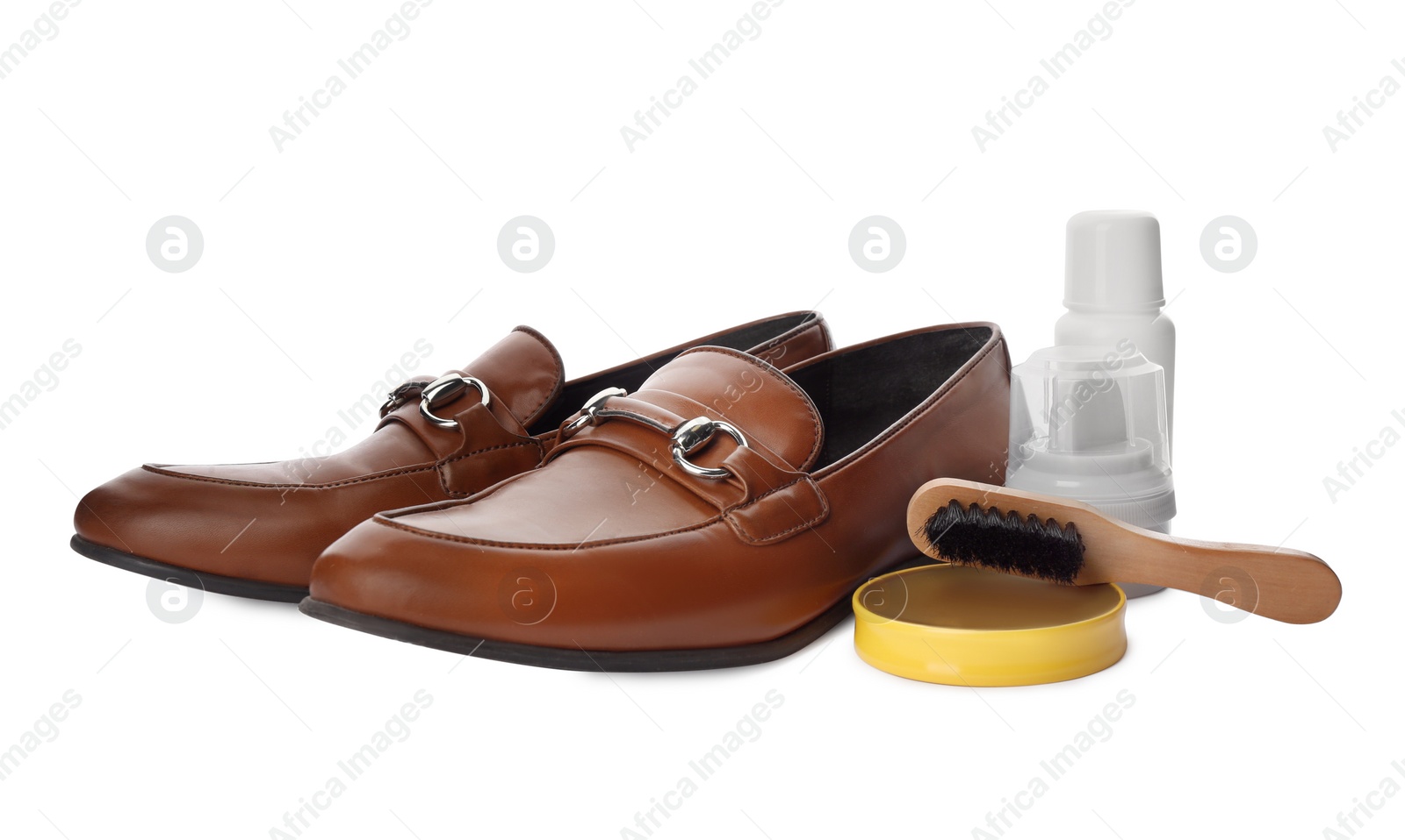 Photo of Stylish footwear and shoe care products on white background