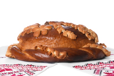 Photo of Rushnyk with korovai on white background. Ukrainian bread and salt welcoming tradition