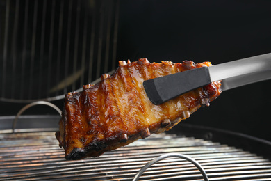 Photo of Delicious ribs on barbecue grill. Yummy meat