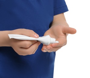 Photo of Child applying ointment onto hand isolated on white, closeup