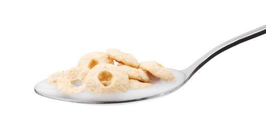 Photo of Cereal rings and milk in spoon isolated on white