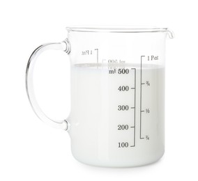 Photo of Fresh milk in measuring cup isolated on white