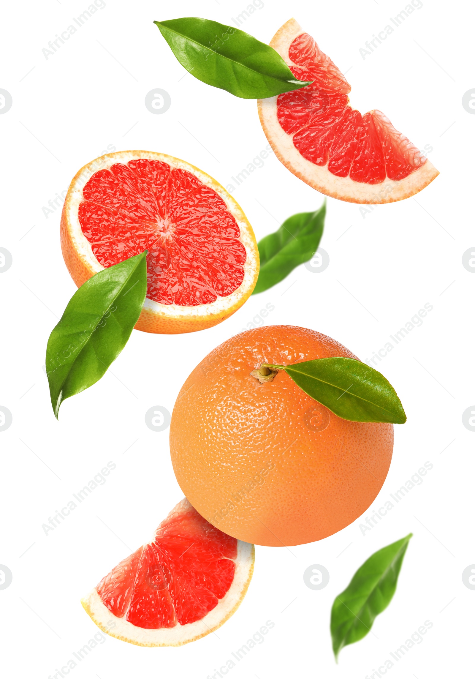 Image of Tasty ripe grapefruits and green leaves falling on white background