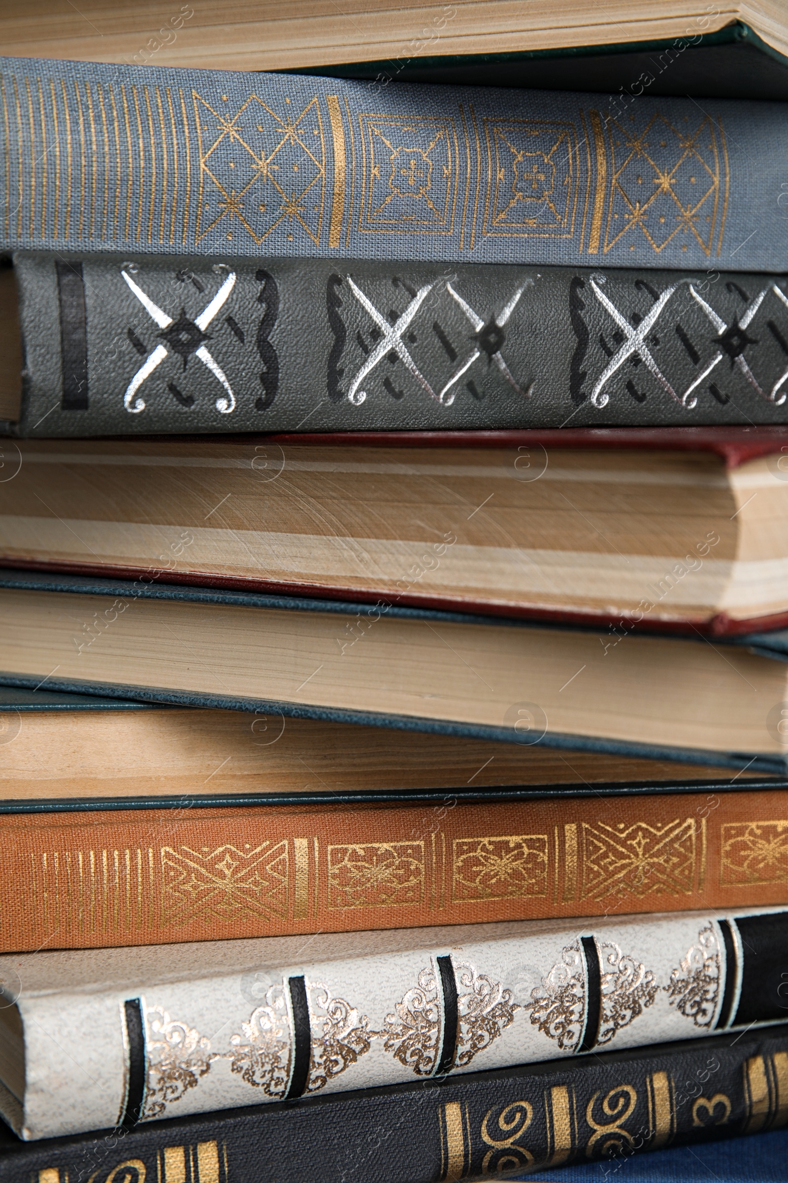 Photo of Stack of hardcover books as background, closeup