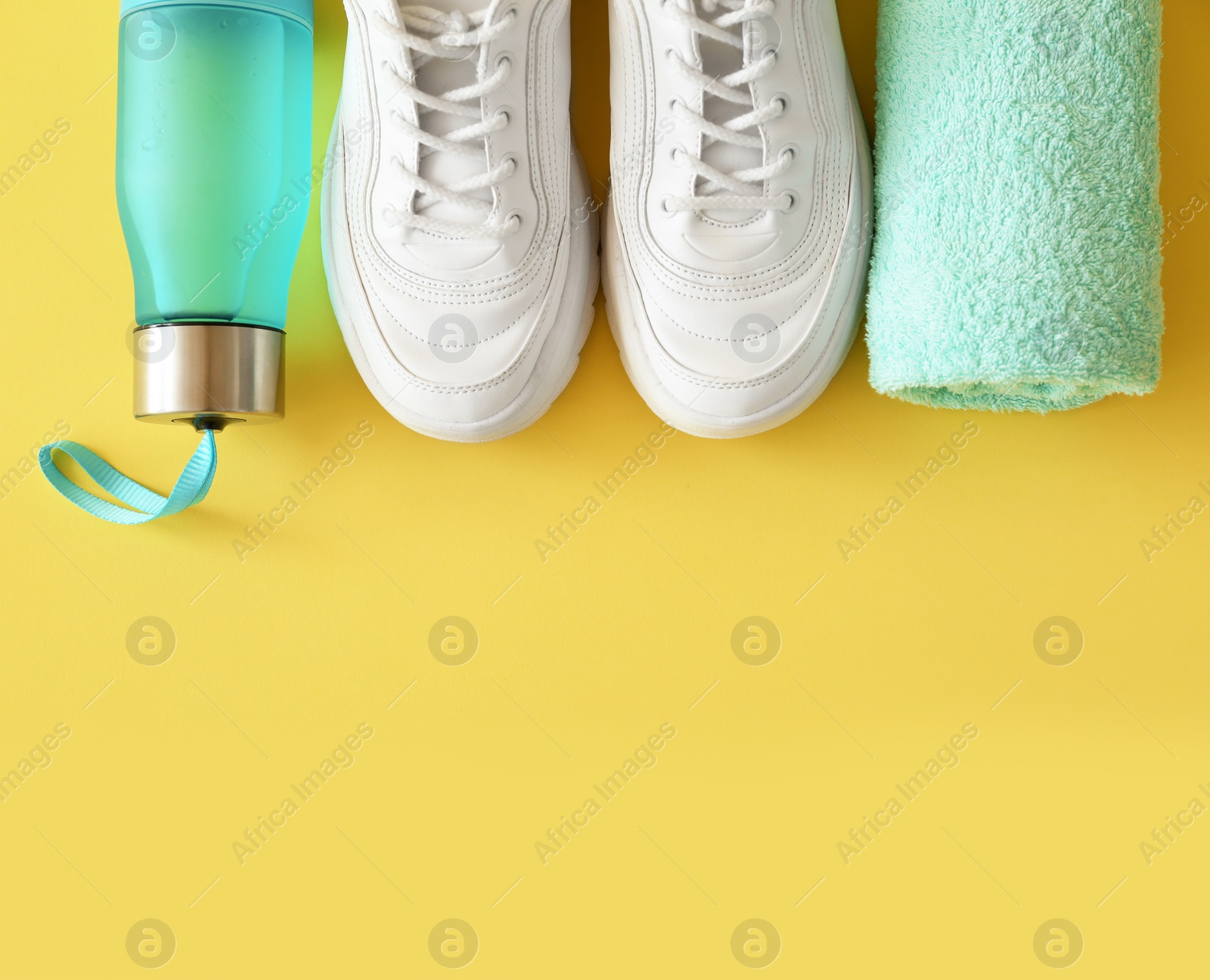 Photo of Flat lay composition with fitness equipment and space for text on color background