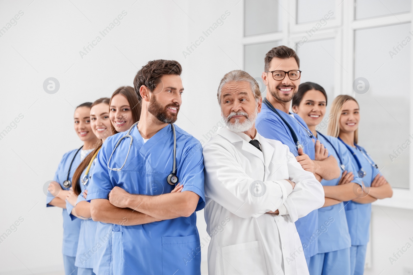 Photo of Doctor and his colleagues in hospital. Medical service