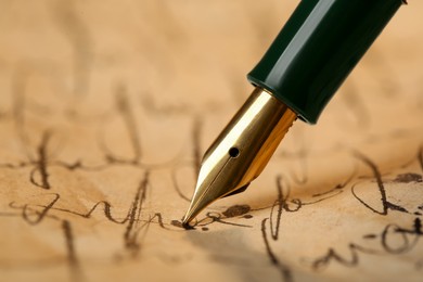 Photo of Writing letter with beautiful fountain pen, closeup