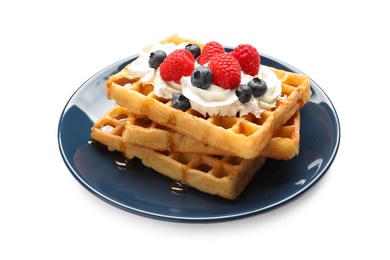 Photo of Plate with yummy waffles, whipped cream and berries on white background