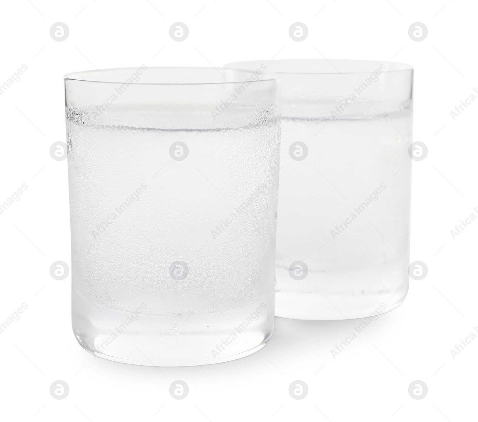 Photo of Vodka in shot glasses on white background