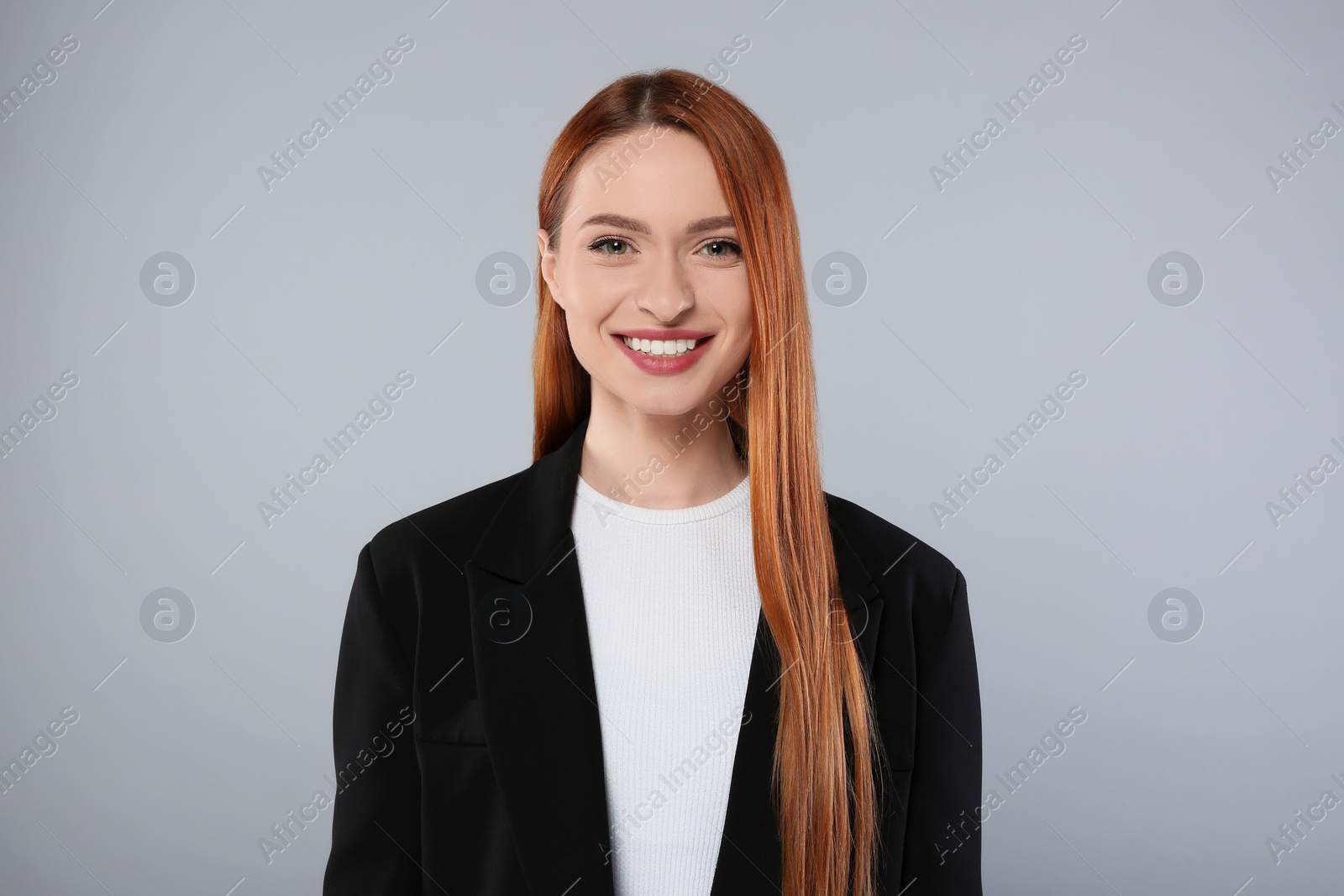 Photo of Portrait of beautiful young woman on light gray background