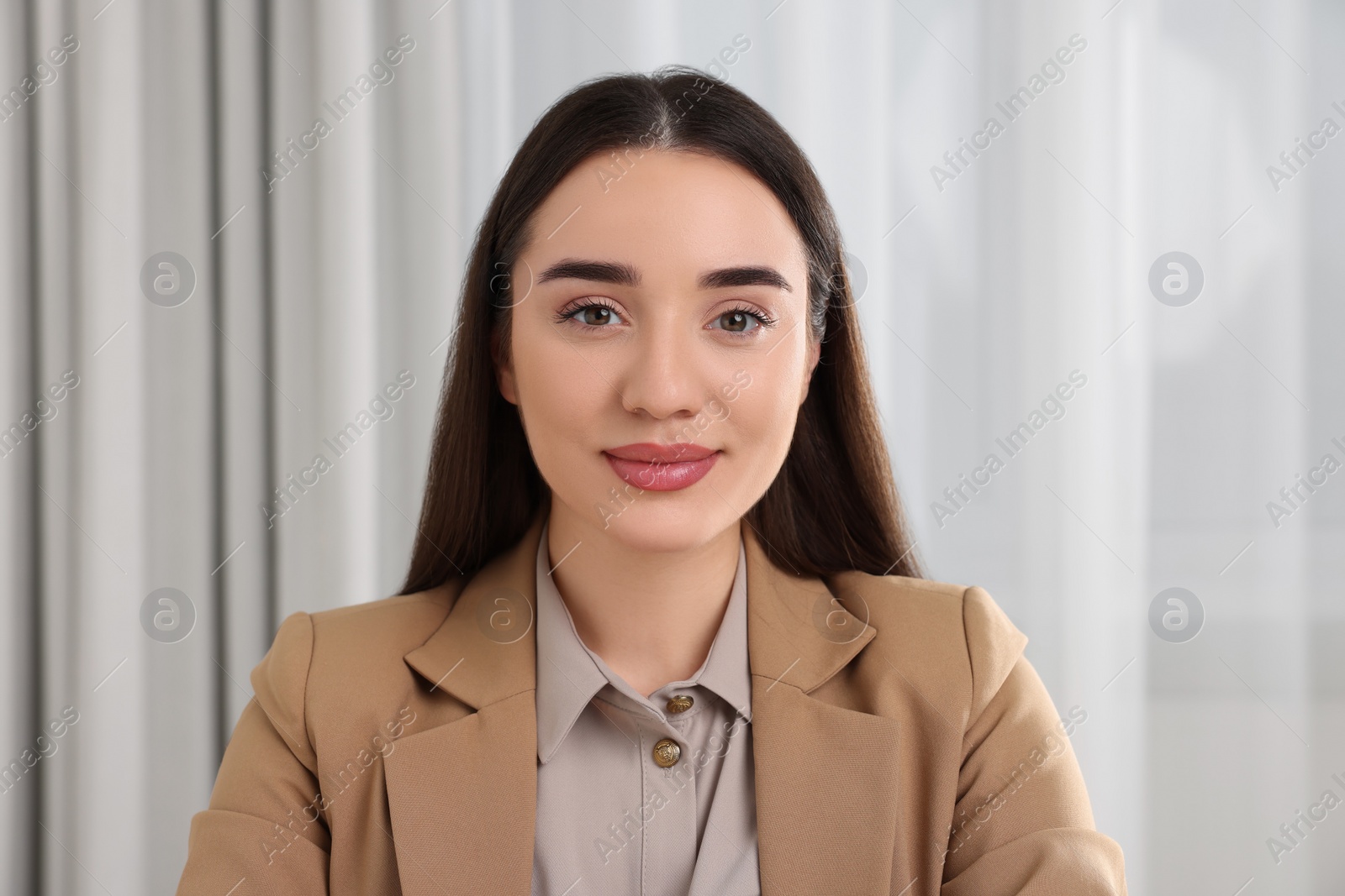 Photo of Beautiful young woman having online video call at home, view from camera