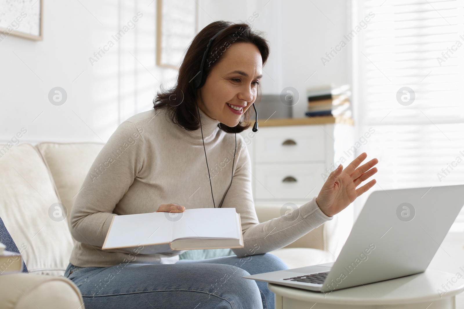 Photo of Teacher conducting online lesson at home during COVID-19 quarantine