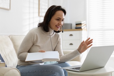 Photo of Teacher conducting online lesson at home during COVID-19 quarantine