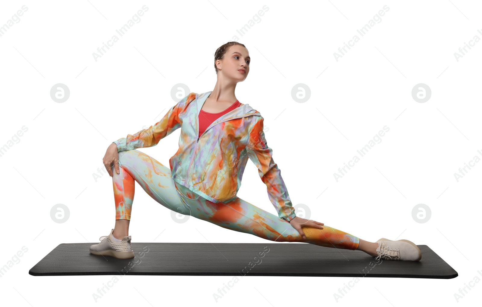 Photo of Yoga workout. Young woman stretching on white background