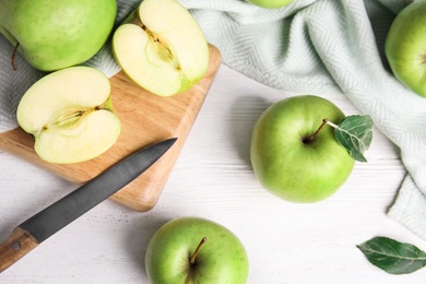 Photo of Flat lay composition of fresh ripe green apples on white wooden table