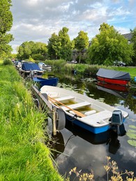 Beautiful view of moored boats in canal on sunny day