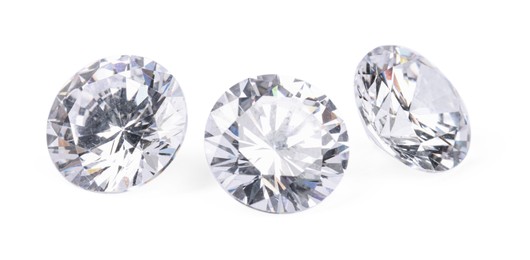 Three beautiful shiny diamonds isolated on white