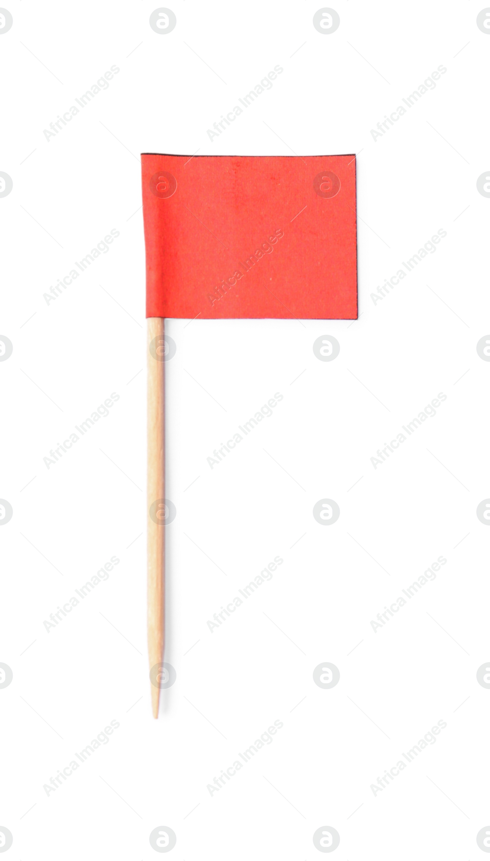 Photo of Small red paper flag isolated on white, top view
