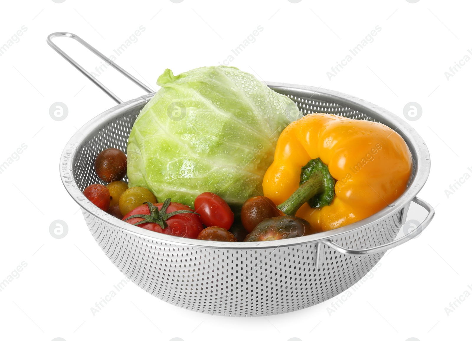 Photo of Metal colander with different wet vegetables isolated on white