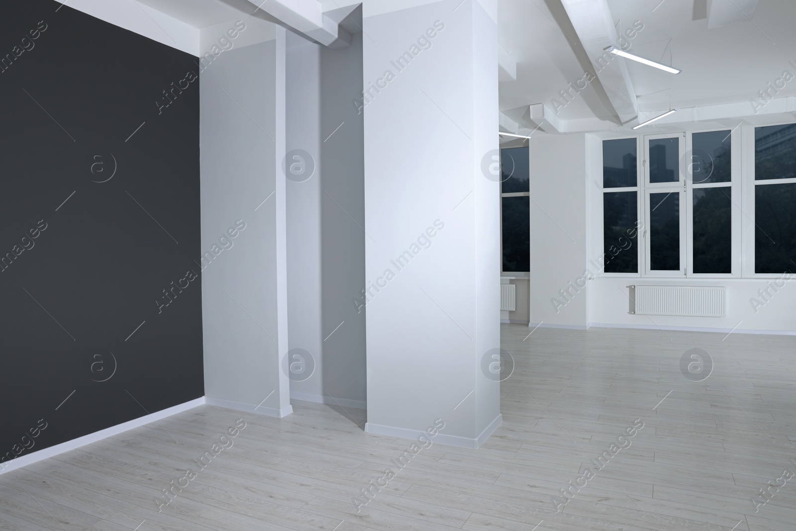 Photo of New empty room with clean windows and light walls