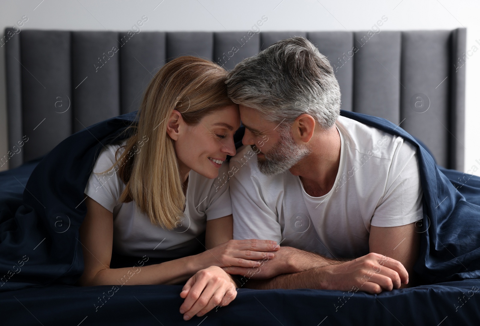 Photo of Lovely mature couple in bed at home