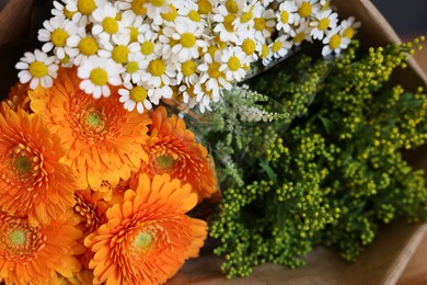 Photo of Beautiful bouquet with chamomile and daisy flowers, closeup. Space for text