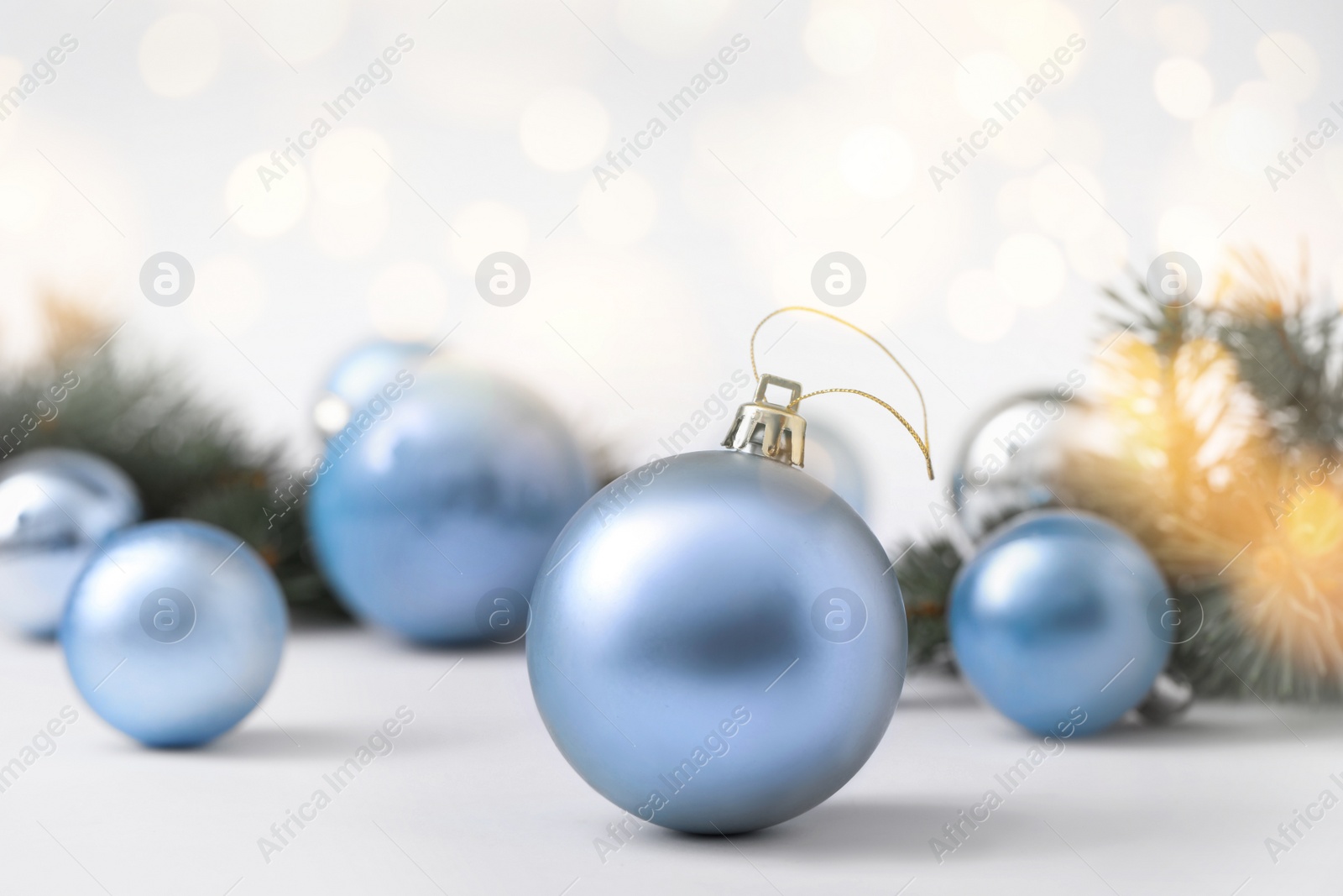 Image of Beautiful Christmas balls on table, bokeh effect