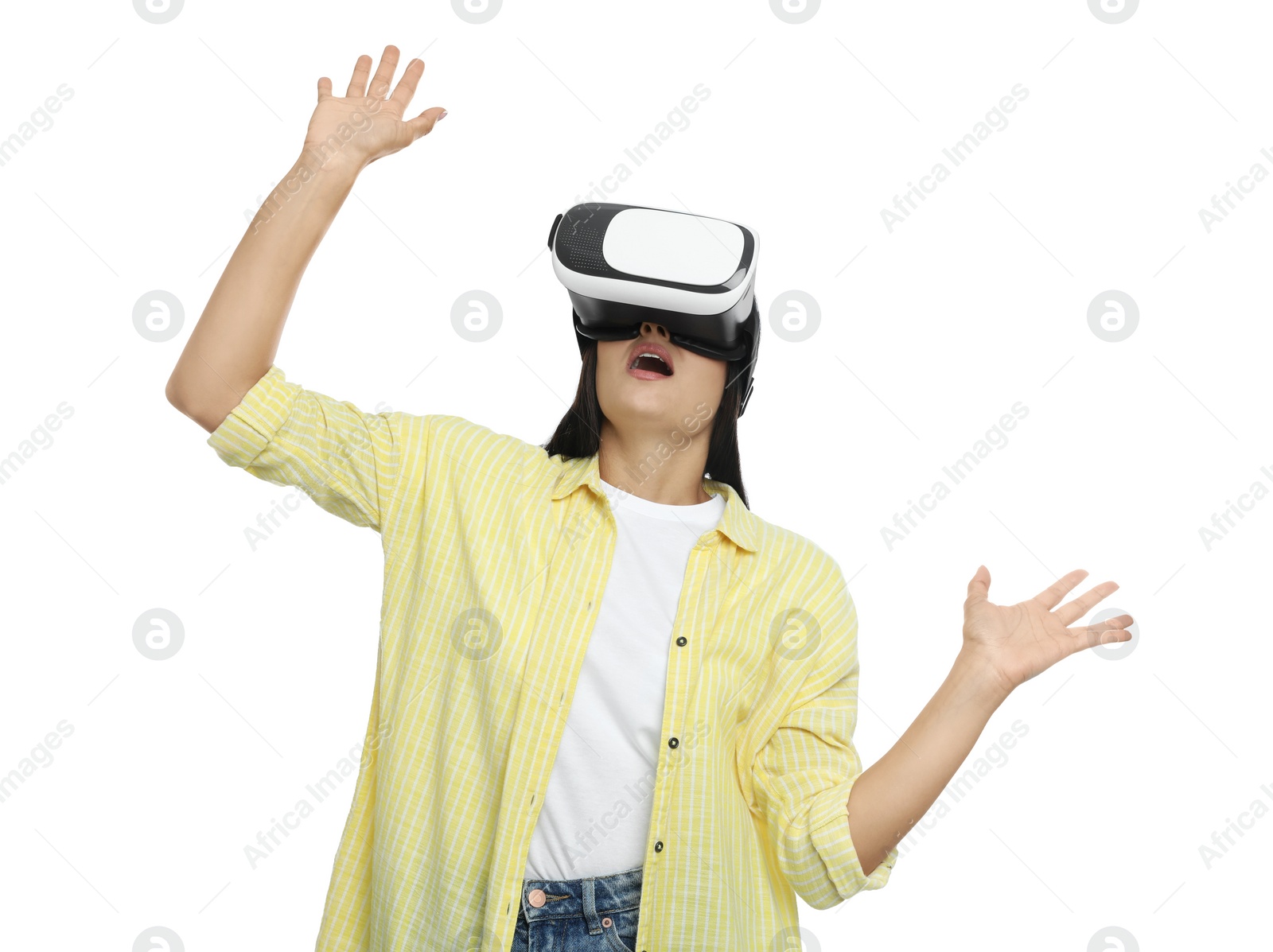 Photo of Emotional woman using virtual reality headset on white background