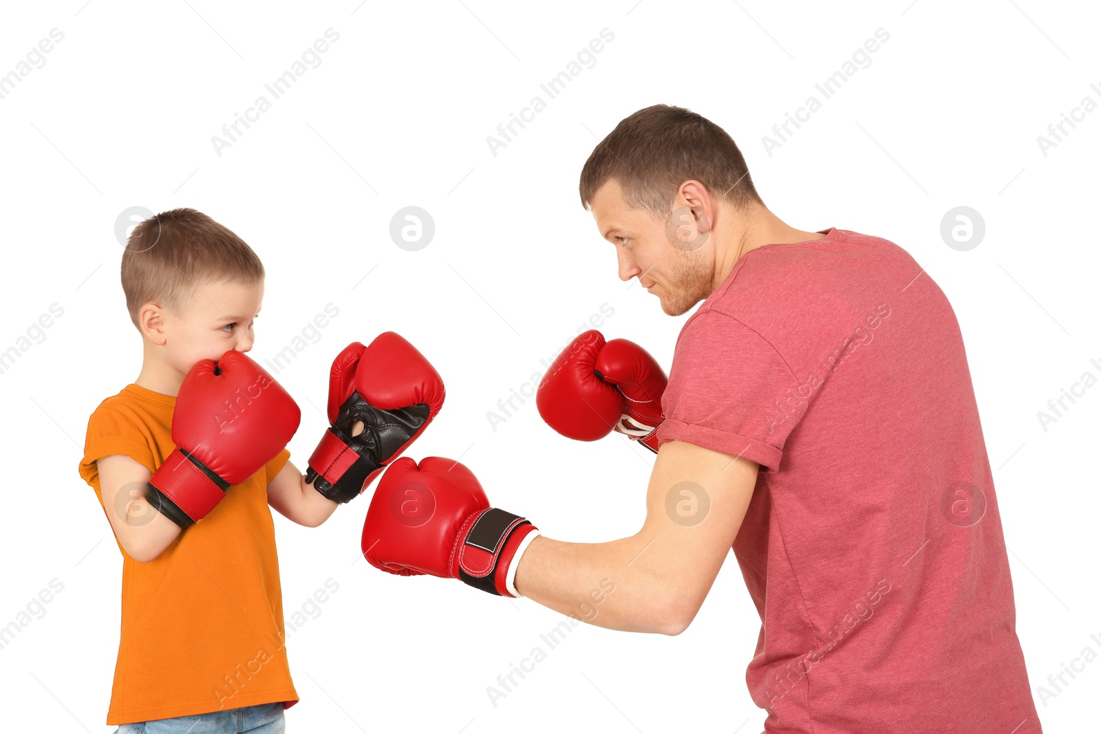 Photo of Happy dad and his son boxing on white background. Father's day celebration