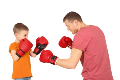 Happy dad and his son boxing on white background. Father's day celebration