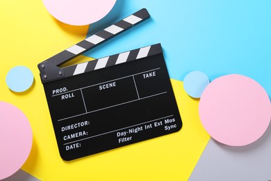 Photo of Clapperboard on color background, top view. Film industry