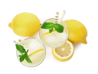 Photo of Natural lemonade with mint and fresh fruits on white background, top view. Summer refreshing drink