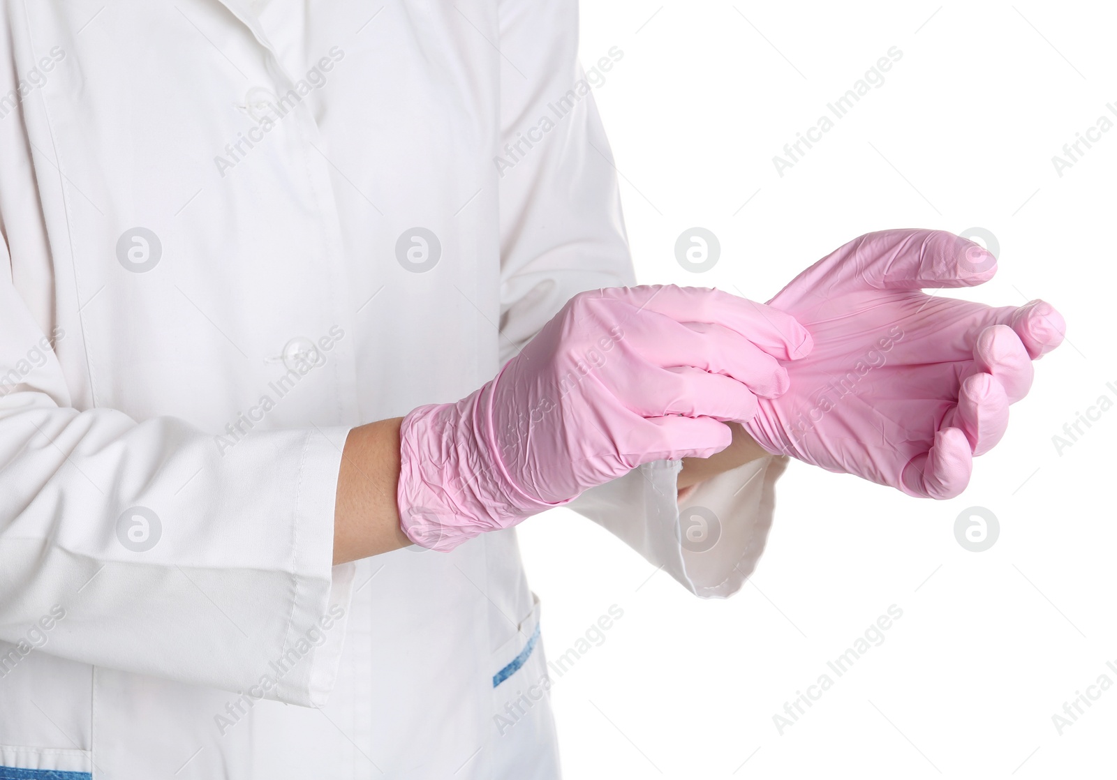 Photo of Doctor taking off medical gloves on white background