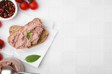 Photo of Delicious liverwurst sandwich and ingredients on white table, flat lay. Space for text