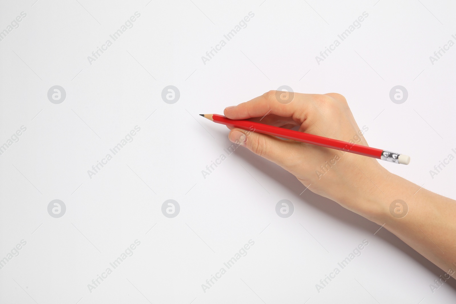 Photo of Woman with new graphite pencil on white background, closeup. Space for text