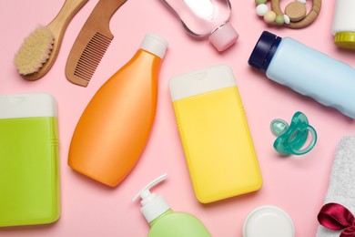 Flat lay composition with baby cosmetic products on pink background