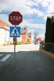 Photo of Many different traffic signs on city street