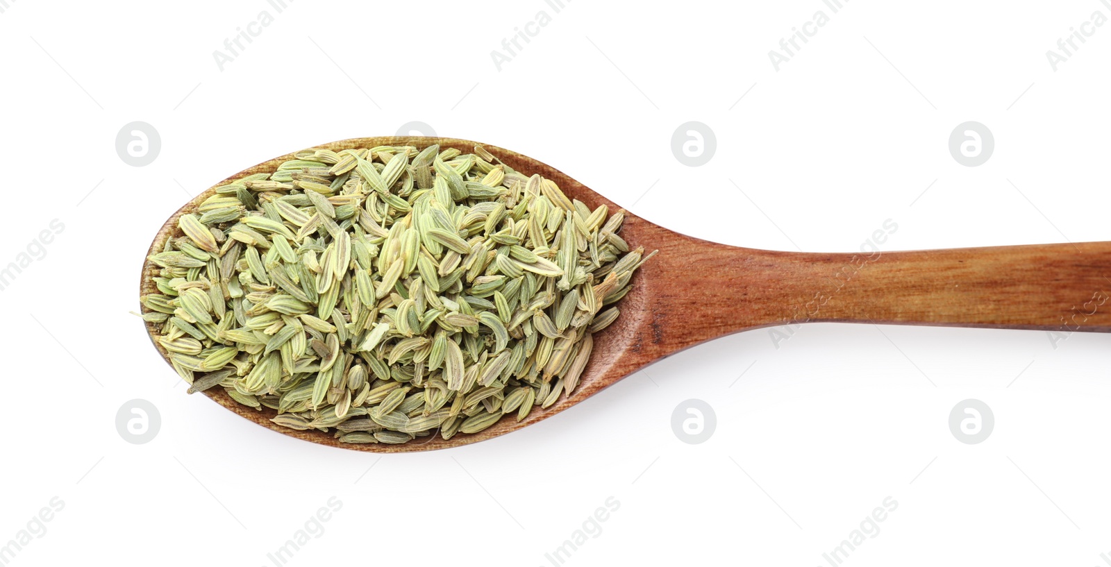 Photo of Dry fennel seeds in spoon isolated on white, top view