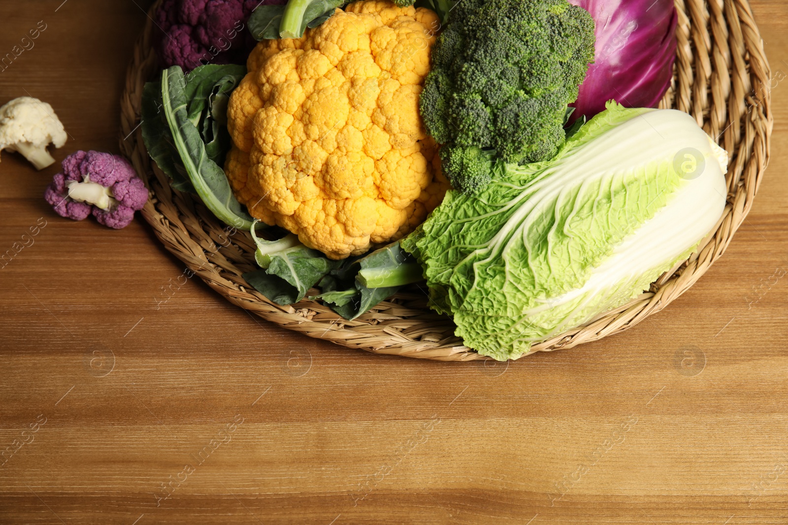 Photo of Different fresh cabbages on table. Healthy food