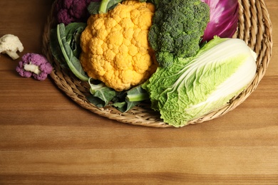 Photo of Different fresh cabbages on table. Healthy food