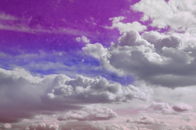 Magic sky with fluffy clouds toned in bright colors