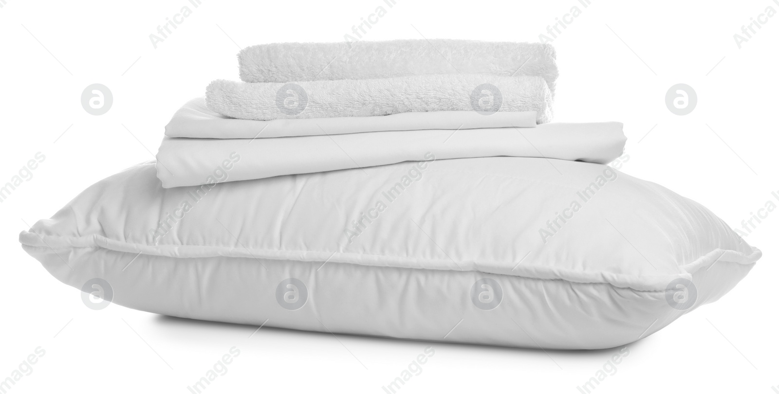 Photo of Pillow, bedding and towels on white background