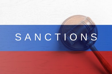 Image of Economic sanctions against Russia because of invasion in Ukraine. Judge's gavel and Russian flag, top view. Double exposure