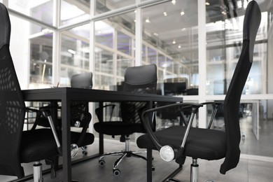 Comfortable office chairs and tables in meeting room