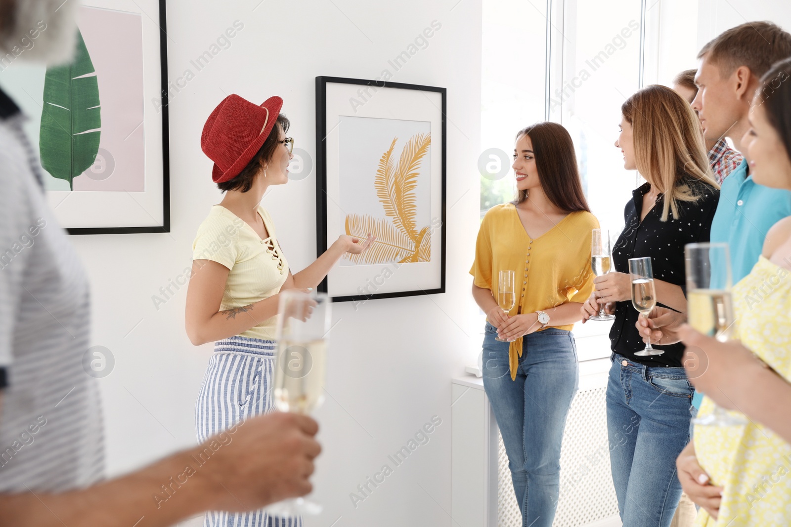 Photo of Group of people with guide at exhibition in art gallery