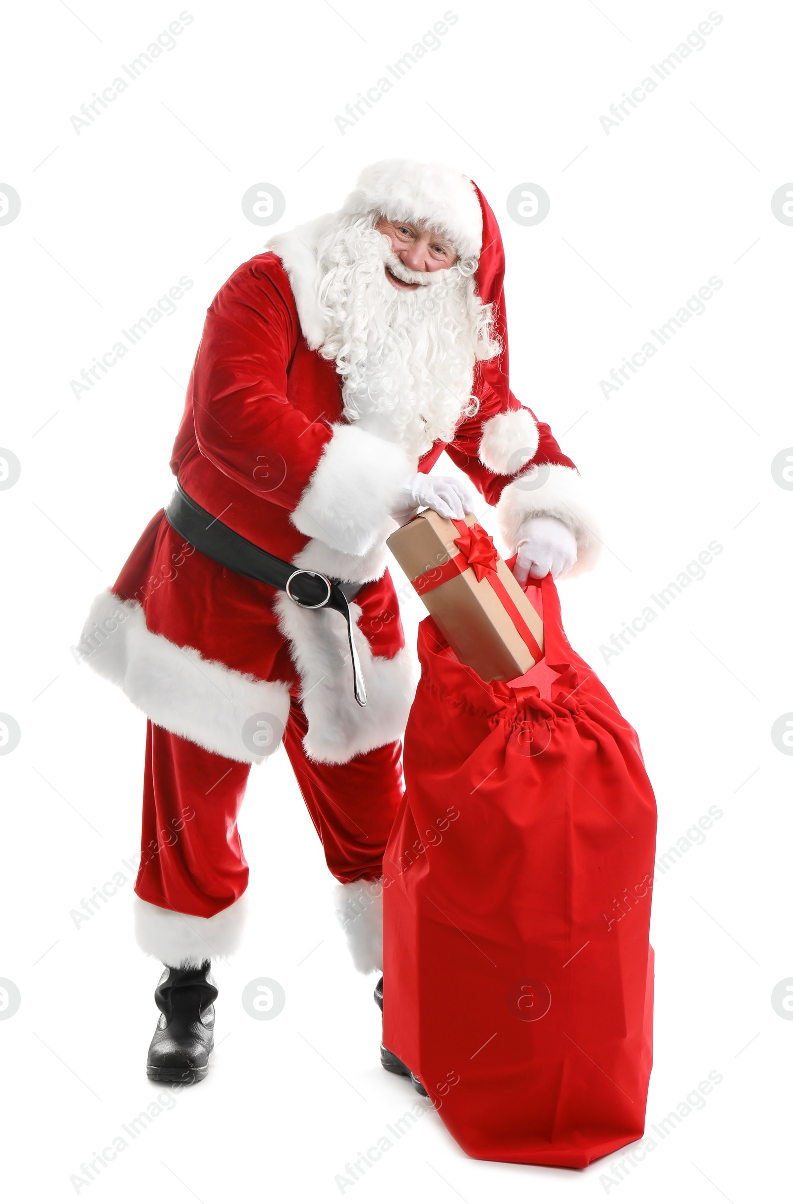 Photo of Authentic Santa Claus with red bag full of gifts on white background