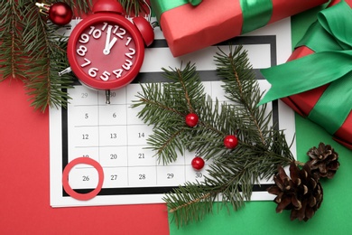 Flat lay composition with calendar and gifts on color background. Boxing day concept