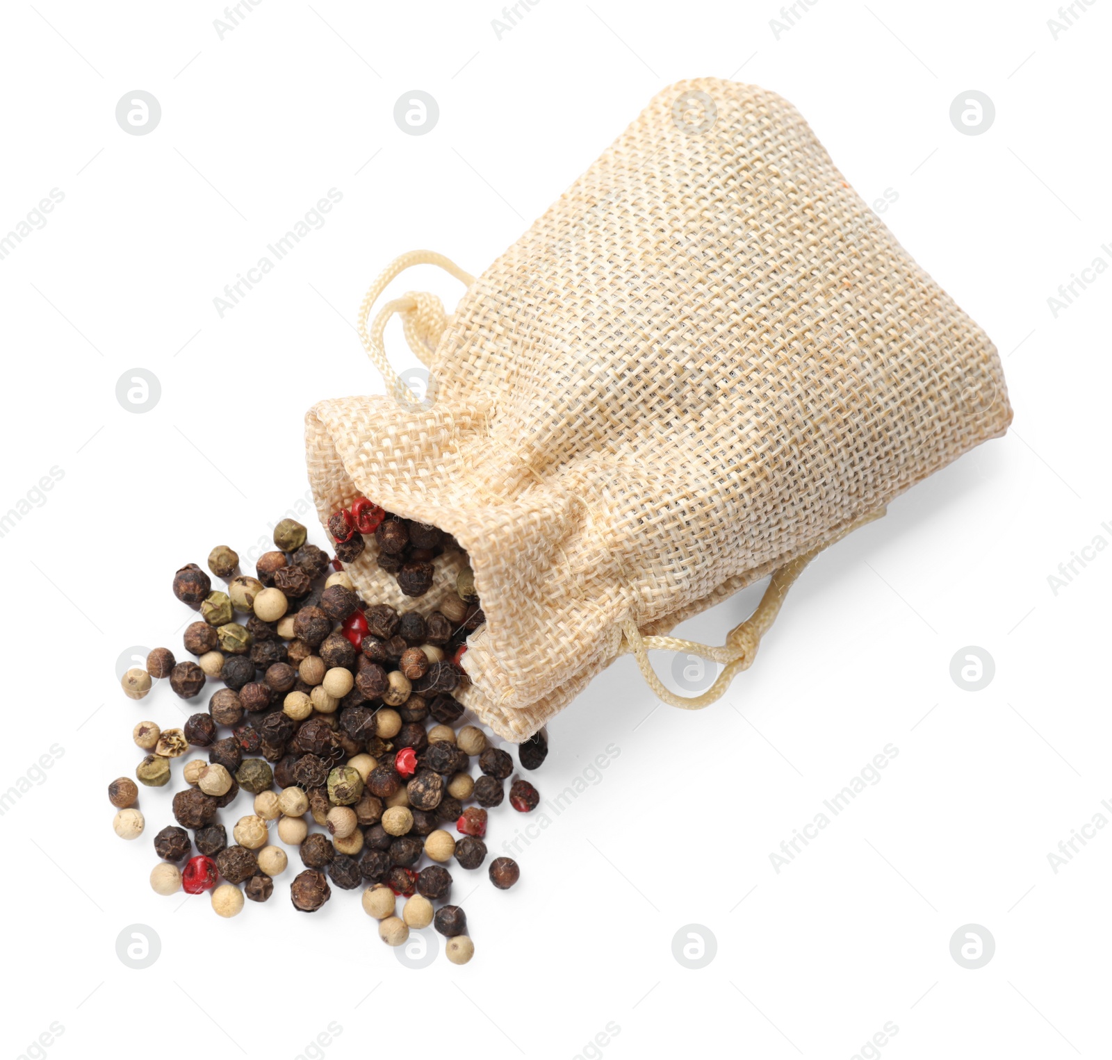 Photo of Aromatic spices. Different peppers in bag isolated on white, top view