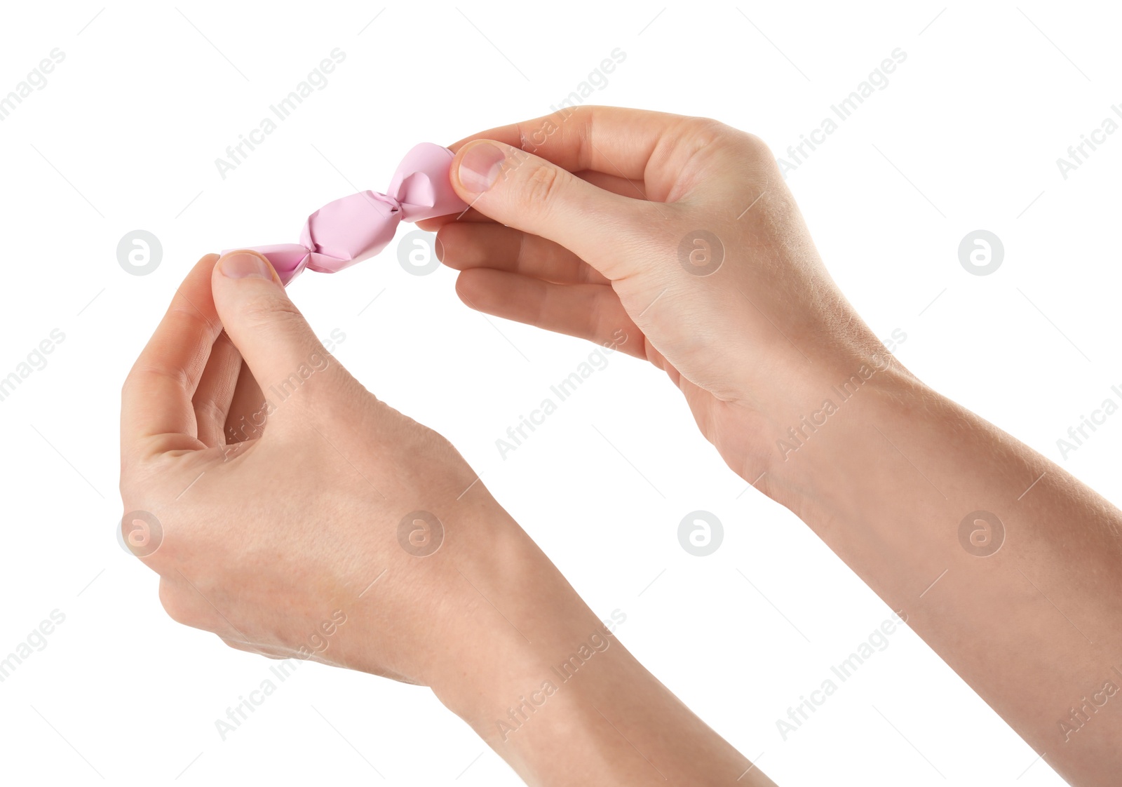 Photo of Woman unwrapping delicious candy isolated on white, closeup