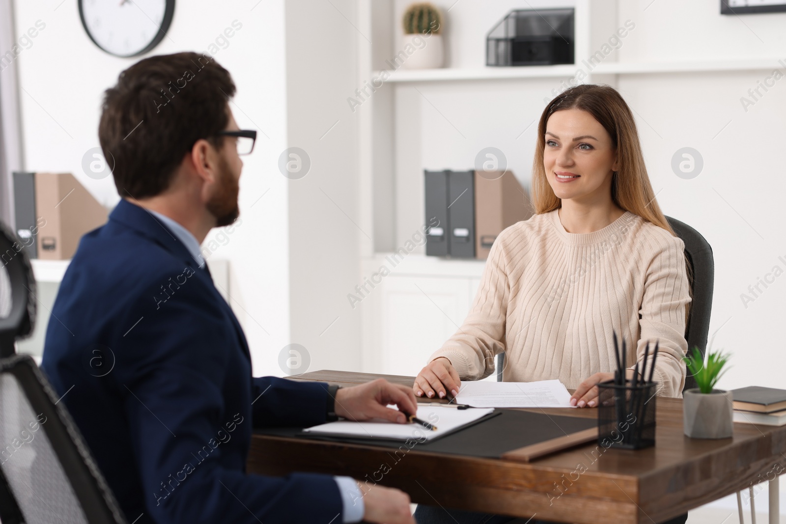 Photo of Woman having meeting with lawyer in office